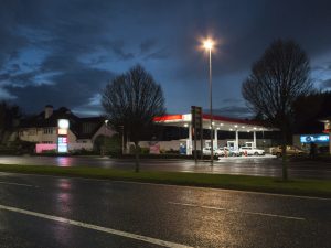 Night Lights shows a 35mm digital colour photo image of an evening scene of a petrol station on the N11 roadway, South Dublin