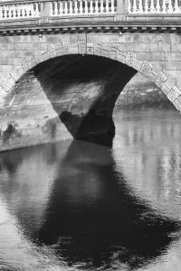 Cityscapes One shows a 35mm black and white image of a detail of a River Liffey, Dublin, bridge and shadow in the river water