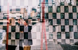 Double Exposure shows 35mm colour film images of people against buildings/hard surfaces at the Grand Canal Dock, Dublin and shot in double exposure mode. 