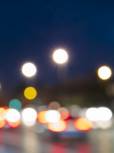 Night Circles Stillorgan shows a 35mm digital colour image of blurred lights from on-coming traffic and street lights on the N11 at Stillorgan Dublin on a winter's evening