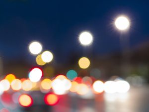 Night Circles Stillorgan shows a 35mm digital colour image of blurred lights from on-coming traffic and street lights on the N11 at Stillorgan Dublin on a winter's evening