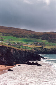 This photograph in 35mm Kodak Ektar colour film shows an image of the sea hitting the beach at Clogher Beach