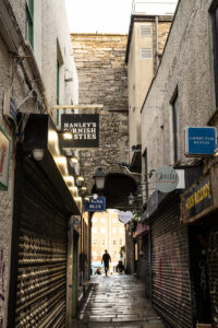 A Friday stroll in Dublin City showing 35mm digital image of a lane and an archway under a building taken on a mid-morning walkabout around parts of the city centre