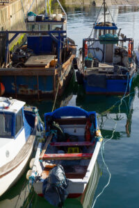 Sea Fever shows 35mm digital colour photographic images of fishing and pleasure boats moored in the harbour at Balbriggan in Co Dublin