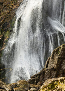 A 35mm digital colour photographic image of the famous Powerscourt Waterfall showing the rush of water from another angle.