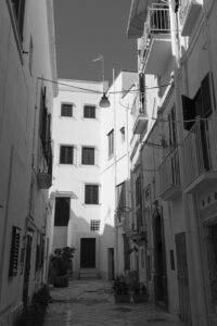 Monopoli Italy Scenes shows a 35mm digital image in monochrome of a quiet alleyway in the old town part of Monopoli, Puglia, Italy 