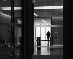 Silhouette shows a 35mm digital B&W image of person in silhouette in an office building in Dublin city