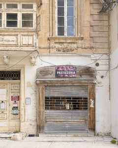 Vanishing Malta 2025 shows a 35mm digital colour image of a disused and delapitated shop