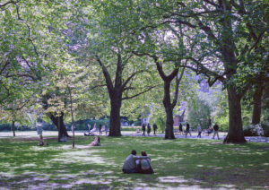 Recent Photos shows a 35mm colour film image of St Stephen's Green, Dublin, on a sunny day with people enjoying the shade 
