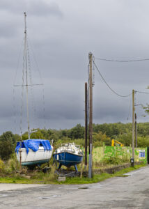 New Additions shows a 35mm digital colour photo of boats on dry land in Co Donegal, Ireland
