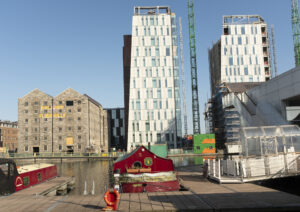 New Additions shows a 35mm digital colour image building works at a Grand Canal Dock in Dublin City where buildings are being built in place of old building stock