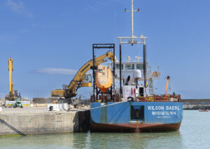 New Additions shows a 35mm digital colour image of a ship unloading in Wicklow town harbour