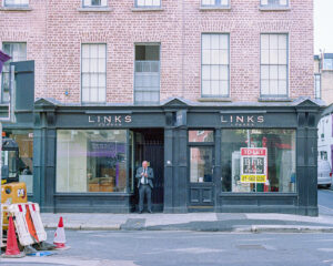 New Photos shows a 35mm colour film photo image of a shop in Dublin City