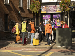 Where to now? is a 35mm digital colour image of tourists in conversation in Temple Bar, Dublin